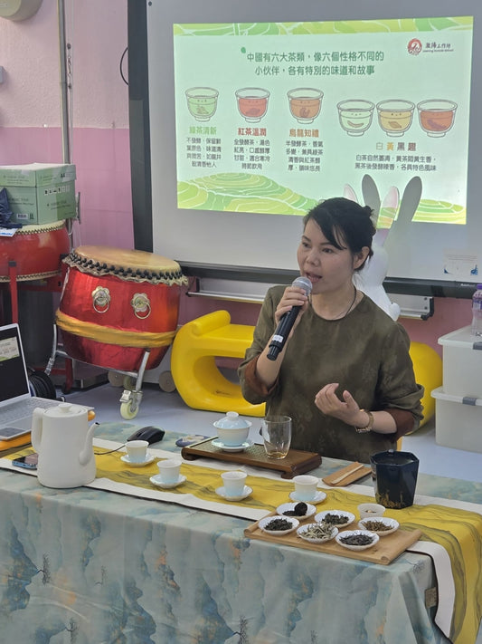 Camellia Wisdom tea arts community workshop — participants experiencing a moment of calm at the tea table.